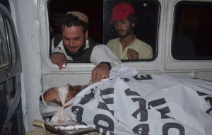 Pashtun looks at deceased relative (Credit: washingtonpost.com)